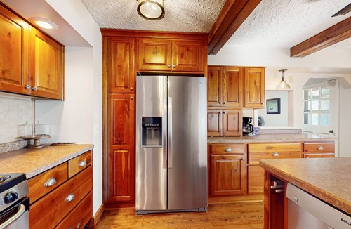 Lac du Flambeau House | Lakefront house with private covered hot tub, dock, wood fireplace, & firepit