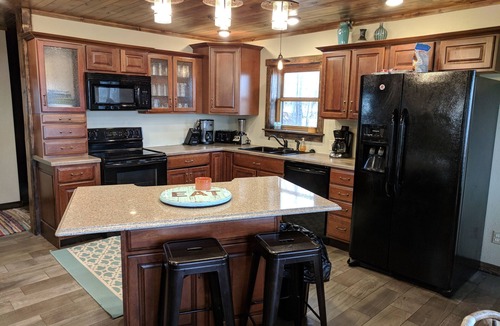 Lake Shore Cabin | Large lake front cabin, has 2 kitchens and comes with a pontoon! Bring the fam!