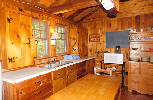 Naples Ski Chalet | Long Lake chalet and guest house with 200' of water frontage and sunset views