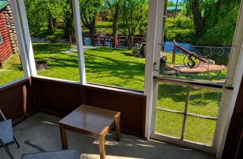 Grayling Cabin | Lovells Riverside Cabin #3 is just steps from the river’s edge with private stair access, and it’s only moments from the iconic Lovells Riverside Tavern.