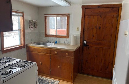 Grayling Cabin | Lovells Riverside Cabin #1 is just steps from the North Branch of the AuSable River with private stair access. You’re also moments from the iconic Lovells Riverside Tavern.