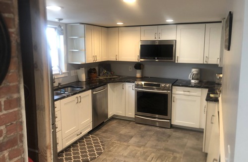 Boyne City House | Lower level of a house located downtown