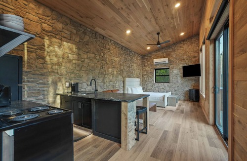 McArthur House | Luxe Stone Cabin | Custom Cave Shower | Hot Tub