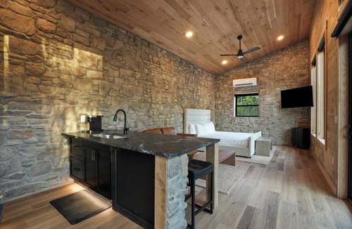 McArthur House | Luxe Stone Cabin | Custom Cave Shower | Hot Tub