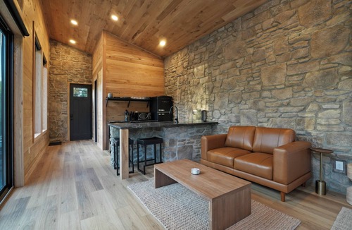 McArthur House | Luxe Stone Cabin | Custom Cave Shower | Hot Tub