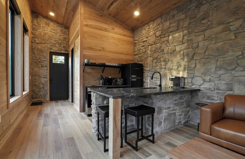 McArthur House | Luxe Stone Cabin | Custom Cave Shower | Hot Tub