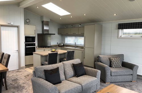 Berwick-upon-Tweed Cabin | Luxurious Oakwood Lodge with Lake View and Glorious Balcony Sunsets