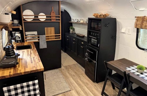Honey Grove House | Luxurious Remodeled Airstream with Wraparound Deck and Spa near Honey Grove, Texas