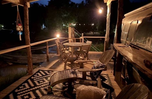 Honey Grove House | Luxurious Remodeled Airstream with Wraparound Deck and Spa near Honey Grove, Texas