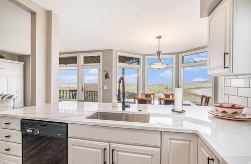 Manistee Condo | Modern Main Floor Waterfront Condo