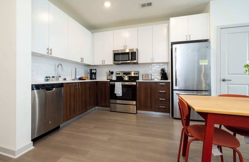 Downtown Louisville Apartment | Modern Nulu 2BR CozySuites 02