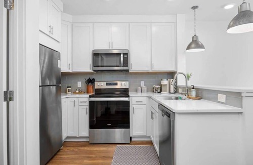 Traverse City Condo | Modern TC Condo w/Patio Close to Beach