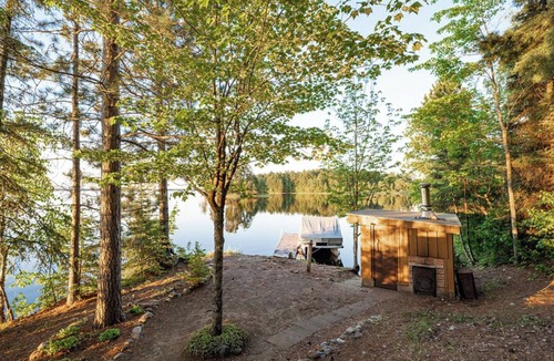 Makinen Cabin | New - Cozy lakefront cabin on private wooded peninsula with bunkhouse and sauna
