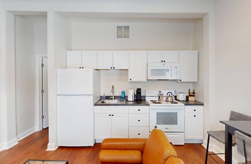Marion Apartment | Newly renovated 1-bedroom apartment designed for comfort and convenience. Enjoy a king bed, 65” Smart TVs in the living room and bedroom, a fully stocked kitchen, workspace, and in-unit washer/dryer. Perfect for visiting Indiana Wesleyan University,