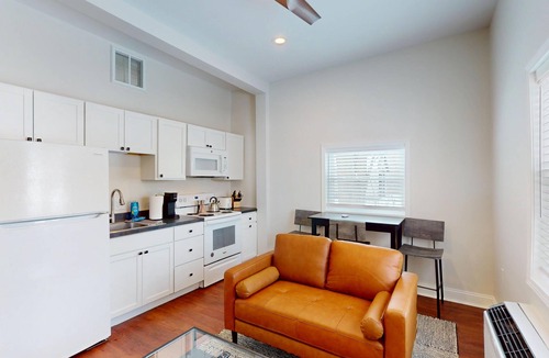 Marion Apartment | Newly renovated 1-bedroom apartment designed for comfort and convenience. Enjoy a king bed, 65” Smart TVs in the living room and bedroom, a fully stocked kitchen, workspace, and in-unit washer/dryer. Perfect for visiting Indiana Wesleyan University,