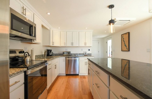 Harrison House | * NEWLY RENOVATED * Modern 4-bedroom home on Long Lake with sunset views!