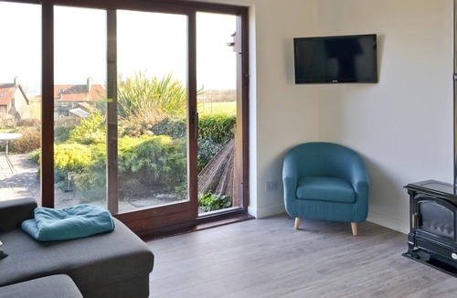 Embleton Cottage | Part of a small terrace of bungalows with uninterrupted views towards the sea.