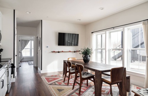 Bellaire Apartment | Pet-Friendly 2BR Family Suite in Boutique Resort w/Hot Tubs, Sauna, & Fire Pit!