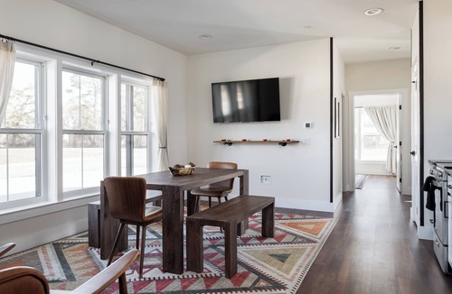 Bellaire Apartment | Pet-Friendly 2BR Family Suite in Boutique Resort w/Hot Tubs, Sauna, & Fire Pit!