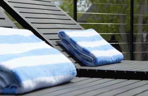 Bellaire Apartment | Pet-Friendly Studio in New Boutique Resort w/Hot Tubs, Sauna, Fire Pit, & More!