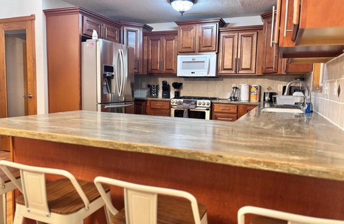 Wichita House | Place in East of Wichita. King Beds with Cinema & Harrison Park Views