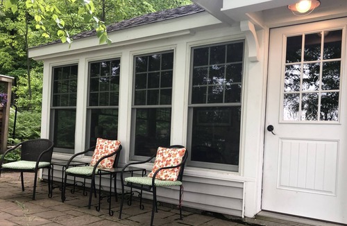 Frankfort Cottage | Quaint cottage on Crystal Lake with 100ft of private, sandy beach frontage.