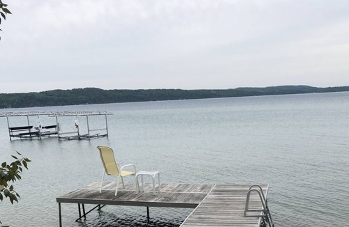 Frankfort Cottage | Quaint cottage on Crystal Lake with 100ft of private, sandy beach frontage.