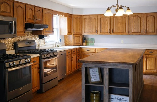 Thompsonville House | Relax at a cozy countryside retreat with a private hot tub, pond views & fire pit — pure bliss. By: Timber Oaks Vacation Rentals