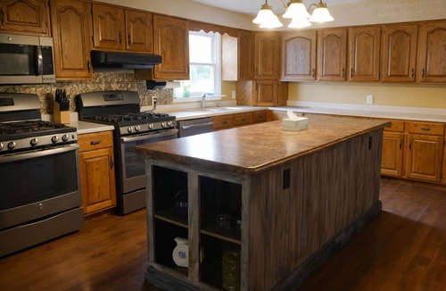 Thompsonville House | Relax at a cozy countryside retreat with a private hot tub, pond views & fire pit — pure bliss. By: Timber Oaks Vacation Rentals