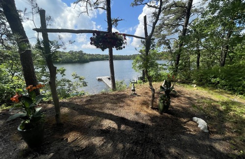 East Harwich House | Relax in a tranquil log home on direct lake front property. The Hermitage awaits