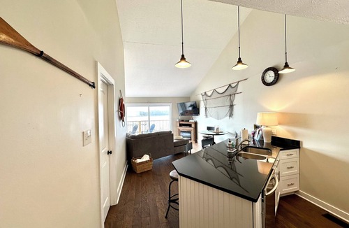 Port Clinton Condo | Relaxing 2-bed, 2 bath. River view with dock. Walk to Jet express!