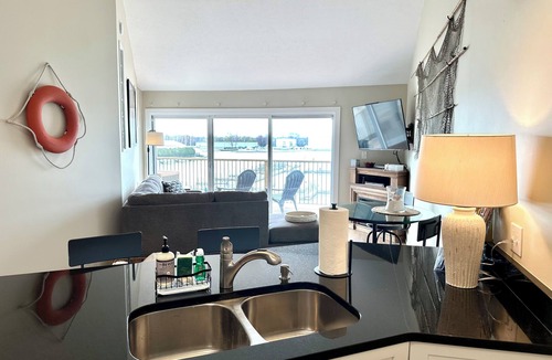 Port Clinton Condo | Relaxing 2-bed, 2 bath. River view with dock. Walk to Jet express!