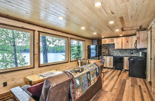 St Germain House | Remodeled lakeside resort cabin with fireplace, sandy beach, dock, firepit!