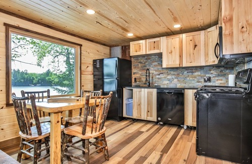 St Germain House | Remodeled lakeside resort cabin with fireplace, sandy beach, dock, firepit!