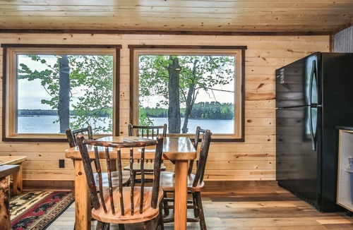 St Germain House | Remodeled lakeside resort cabin with fireplace, sandy beach, dock, firepit!
