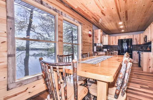 St Germain House | Remodeled lakeside resort cabin with fireplace, sandy beach, dock, firepit!