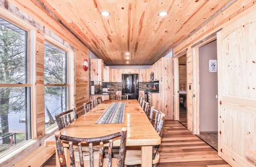 St Germain House | Remodeled lakeside resort cabin with fireplace, sandy beach, dock, firepit!