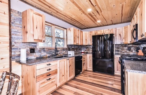 St Germain House | Remodeled lakeside resort cabin with fireplace, sandy beach, dock, firepit!