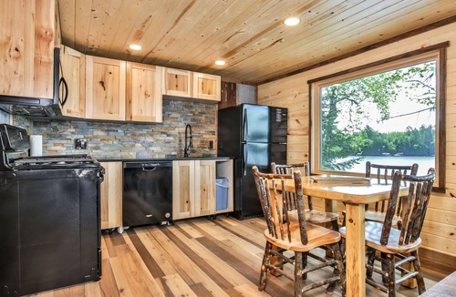 St Germain House | Remodeled lakeside resort cabin with fireplace, sandy beach, dock, firepit!