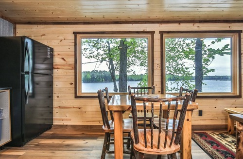 St Germain House | Remodeled lakeside resort cabin with fireplace, sandy beach, dock, firepit!