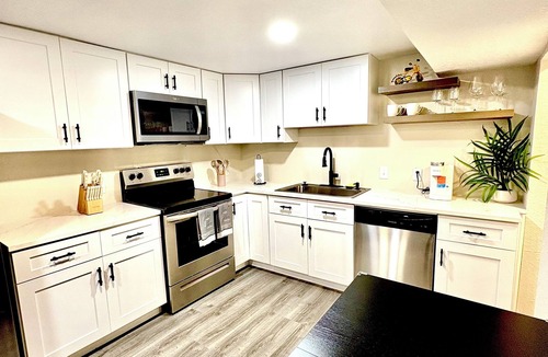 Federal Heights House | Renovated Private Residence Below basement, Garage, EV charger, Fenced patio.