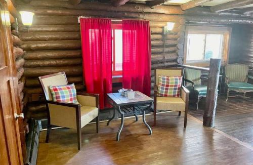 Luna Pier House | Restored historic log cabin & deck on Lake Erie