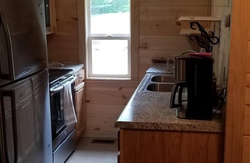 Laurelville Cabin | Ridgetop cabin featuring spa, sun room, fireplace and deck with panoramic views.
