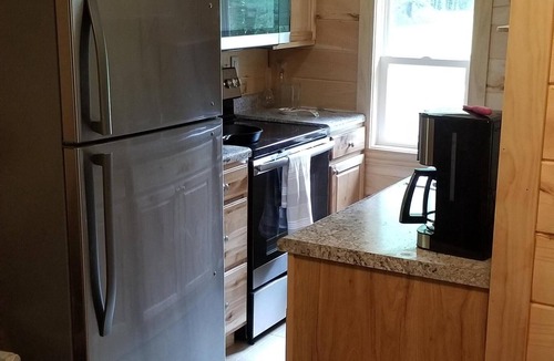 Laurelville Cabin | Ridgetop cabin featuring spa, sun room, fireplace and deck with panoramic views.