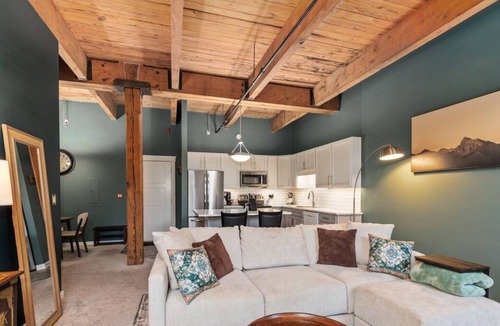 Grand Rapids Condo | Riverfront Condo for Professionals with Workspace & Prime Medical Mile Access.