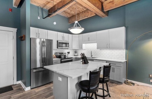 Grand Rapids Condo | Riverfront Condo for Professionals with Workspace & Prime Medical Mile Access.