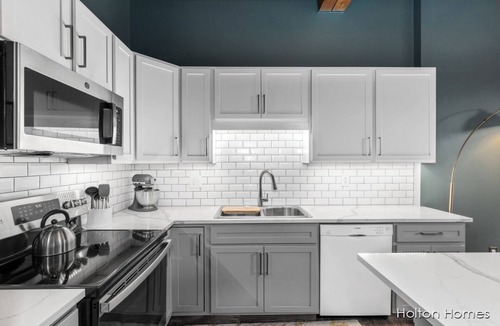 Grand Rapids Condo | Riverfront Condo for Professionals with Workspace & Prime Medical Mile Access.