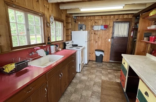 Standish Cottage | Rustic shorefront cottage with a small sandy beach