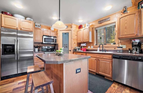 Mancelona House | Secluded Cabin | Direct Trail Access Fire pit