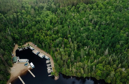 Babbitt House | Secluded Creekside Cabin with Screened Porch Near the Marina in Babbitt, Minnesota